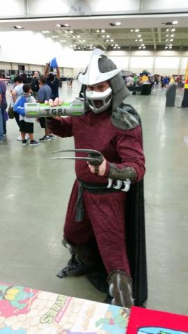 Shredder holding a movie prop from TMNT 2 - Ooze Canister at the Cowabunga Corner booth on Friday.